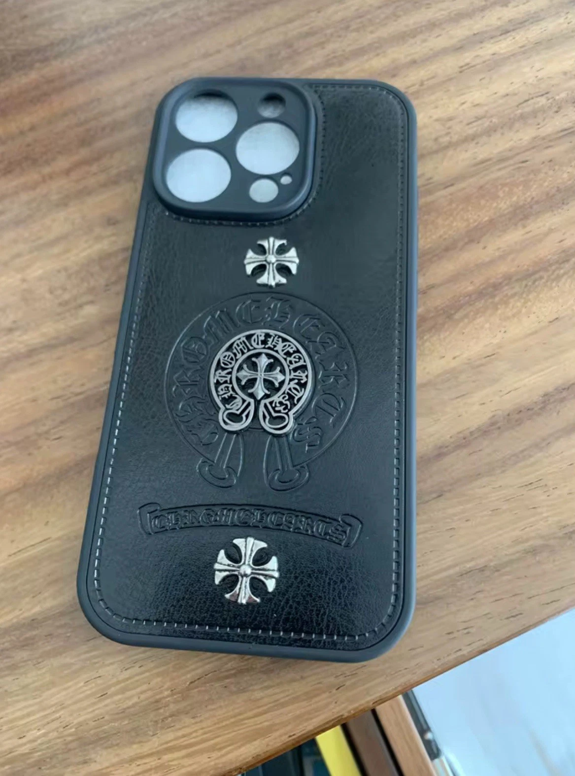 Leather phone case with chrome heart cross Leather phone case with chrome heart cross